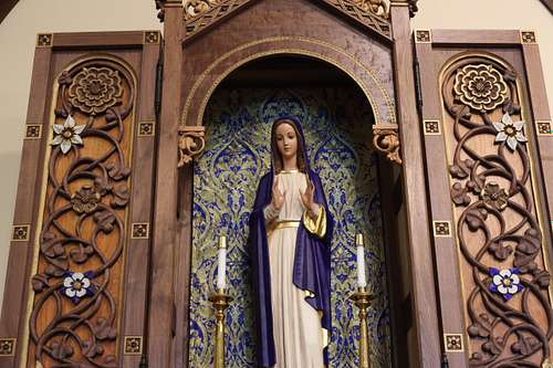 total statue restoration of the Blessed Virgin Mary and a custom, hand-carved shrine with vines and flowers