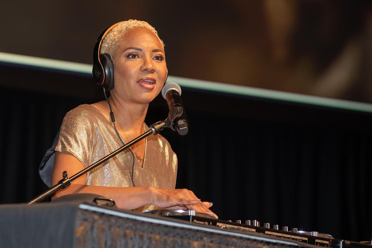 Event photography capturing legendary artist MC Lyte performing as DJ during AFSCME&rsquo;s 45th International Convention in Philadelphia, blending artistry, energy, and leadership through music.
