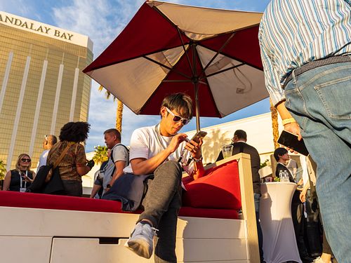 Candid photo of attendees enjoying the Google Workspaces after party — photographed by David Andrade, Las Vegas