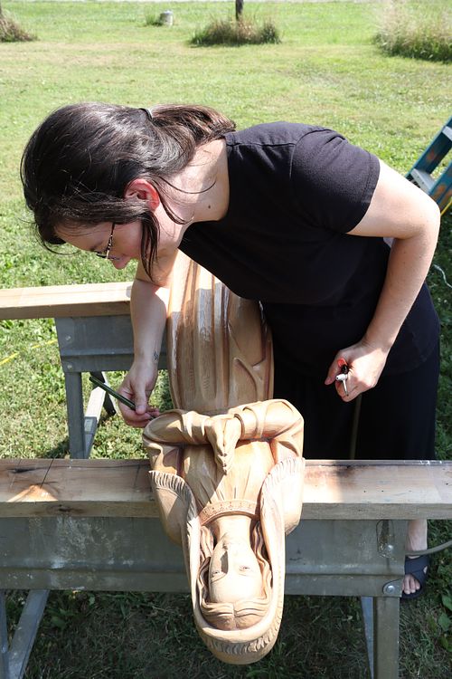 Kelly Baker doing a deep clean of St. Bernadette Statue
