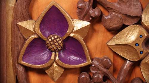 Hand-carved spiderwort flower with purple and gold polychrome paint