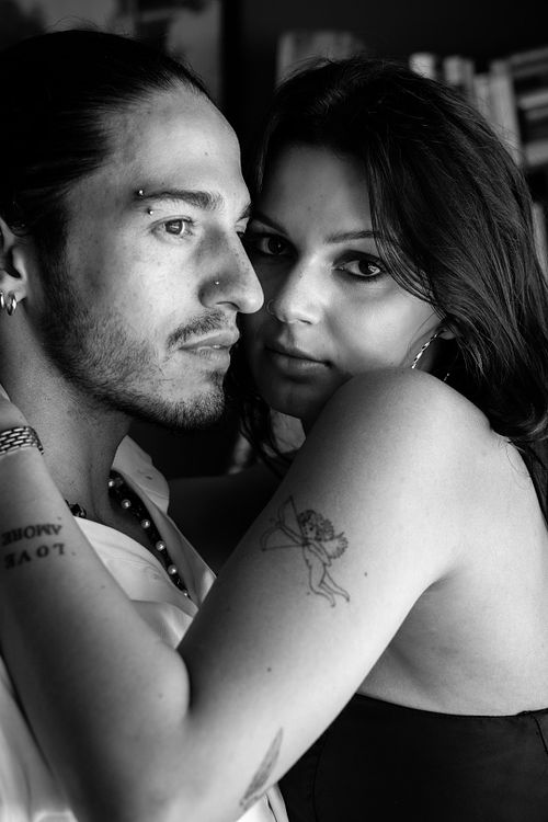 Black and white candid interaction portrait of Julian & Annie in Los Angeles — authentic lifestyle photography by David Andrade