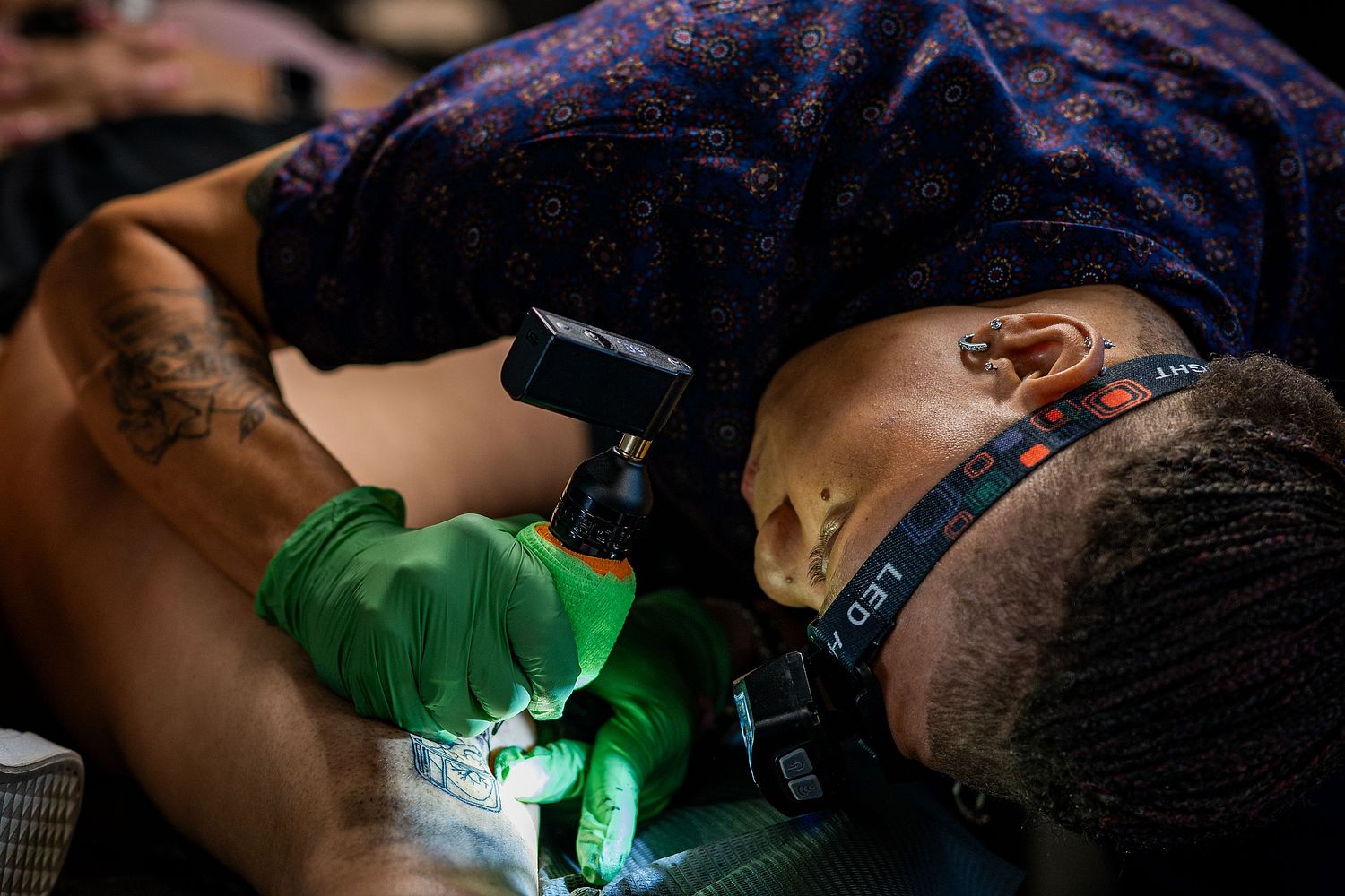 Portrait of woman doing a tattoo, editorial
