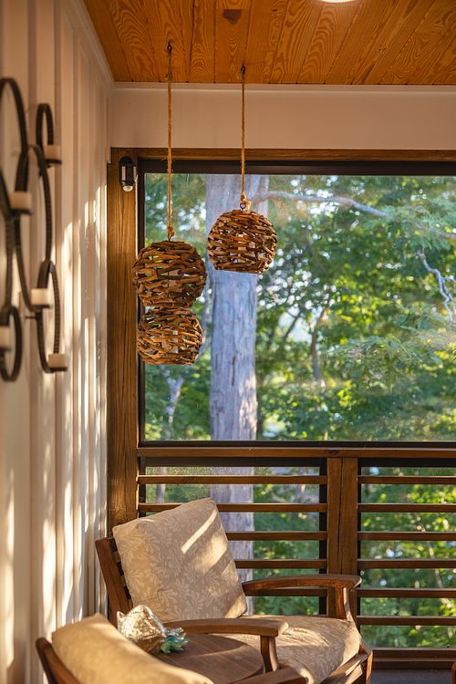 Morning sunlight over reading nook in screened room