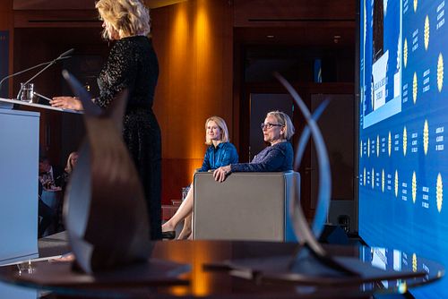 Kaja Kallas on stage at the Axica Convention Centre, with a woman delivering a speech to the left.