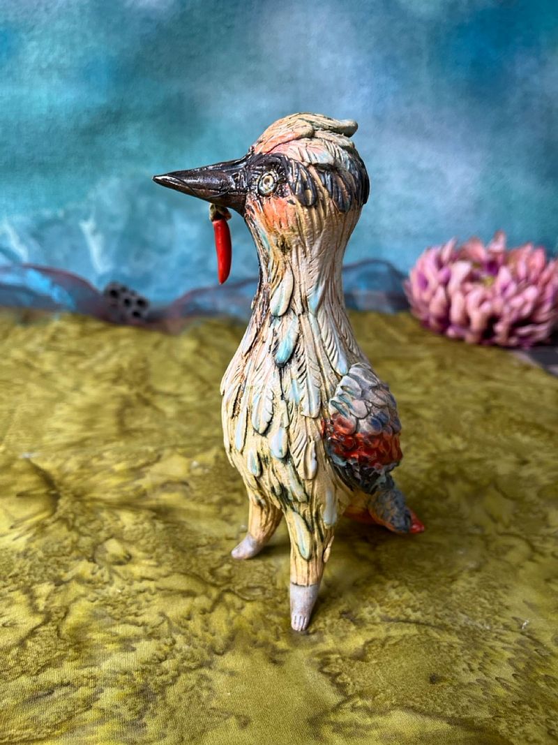 Woodpecker with a prey