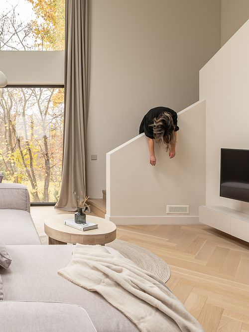 Living room interior with soft light and human presence – Faget project