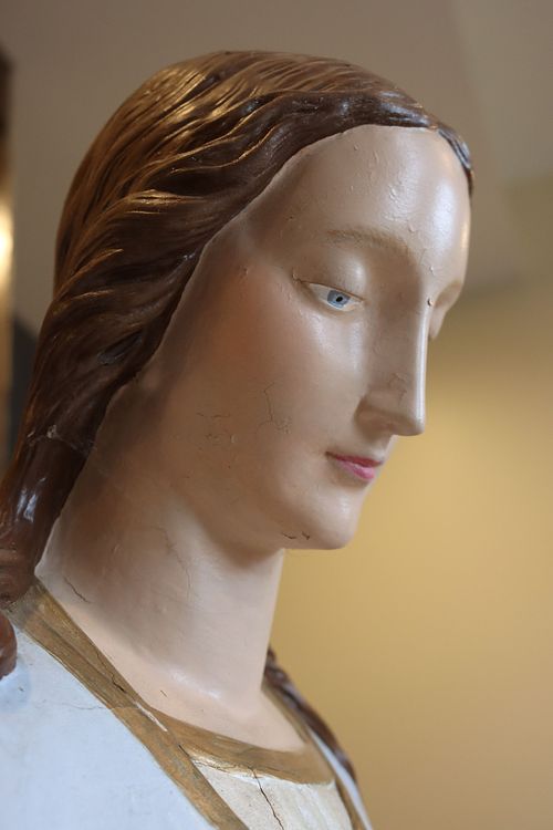Statue of Mary's face in need of restoration