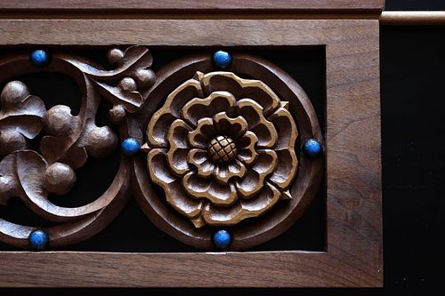detail of hand-carved rose and beads on gradine candle shelves for the altar at St. Bernadette Catholic Church in Lancaster, Ohio