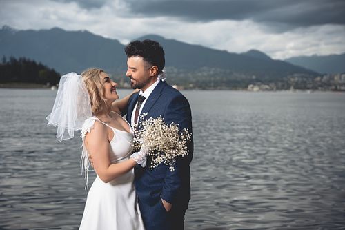 Anniversary couple photography in downtown Vancouver at Coal Harbour