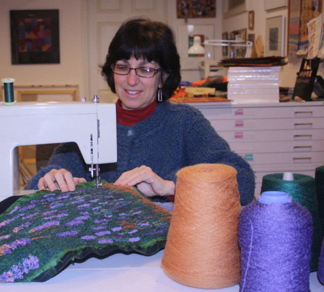 Fiber artist Susan Levi-Goerlich using her sewing machine
