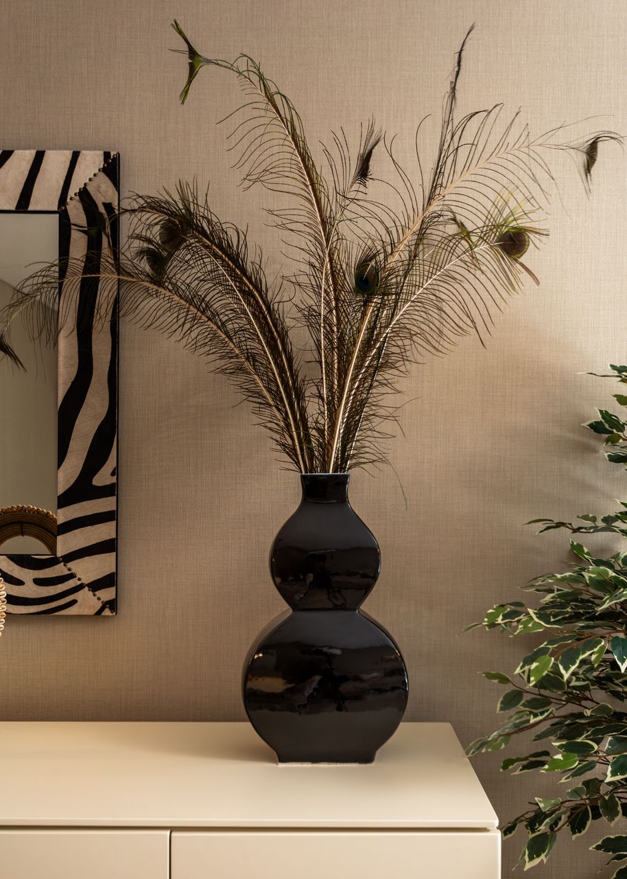 Fotografia de no Apartamento Montijo, destacando a decora&ccedil;&atilde;o com Estilo Africano.