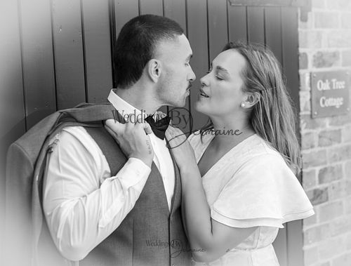 Bride-and-groom-listening-to-officiant-at-Oakham-Registry-Office