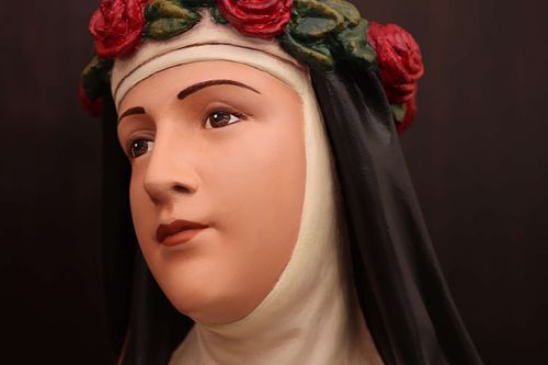 Saint Rose of Lima's face after restoration by Wes and Kelly Baker of Contrasts Woodcarving