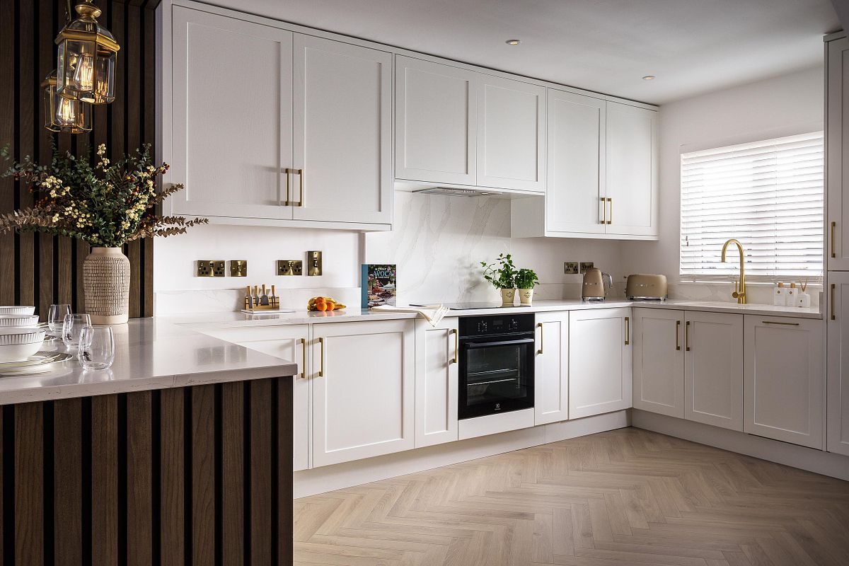 DWK Kitchens "Kelly" Kitchen: White Cabinetry and Gold Accents