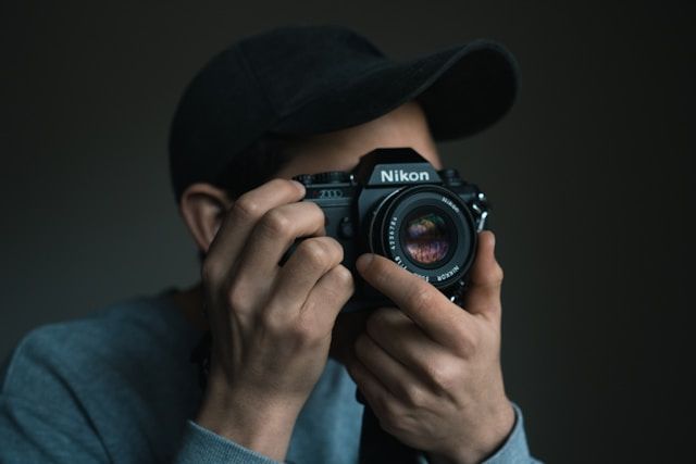 Image of a photographer ready to take a shot