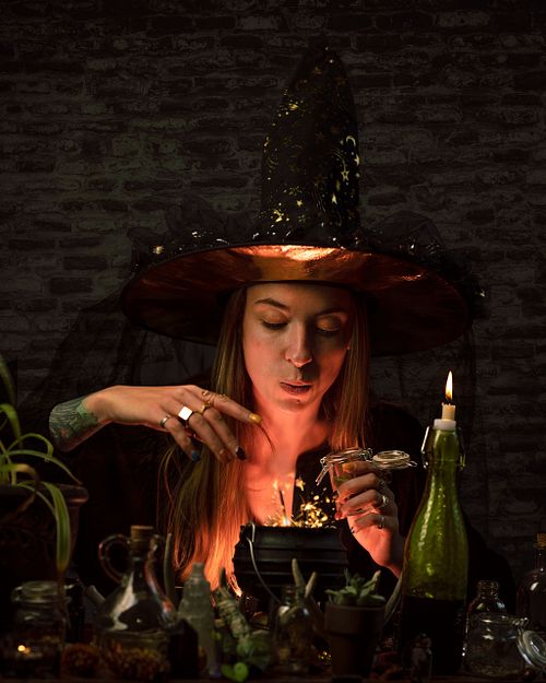 A witch making potions in her lab.