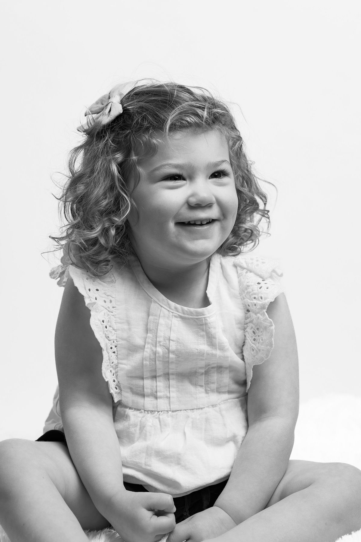 A young girl photographed in black-and-white at a studio in Carrboro, NC