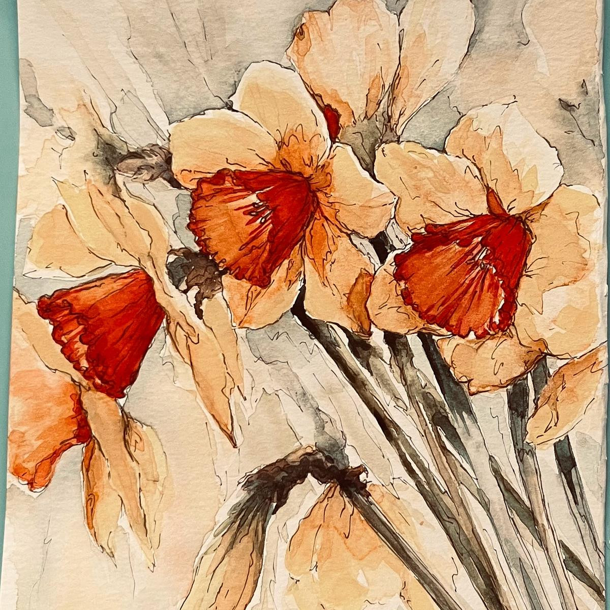 creamy yellow and burnt orange centres of the bunch of English daffodils of springtime.