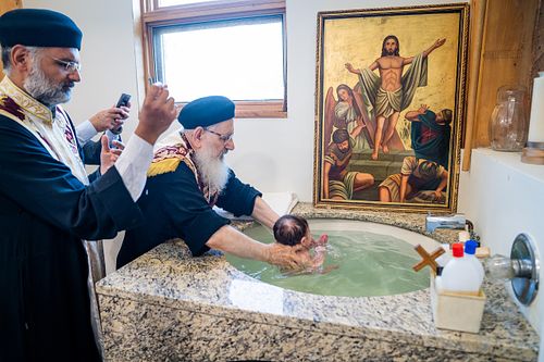 baby baptism ceremony at Ottawa church captured by Kameel Photography