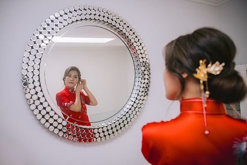Chinese bride getting ready for traditional tea ceremony