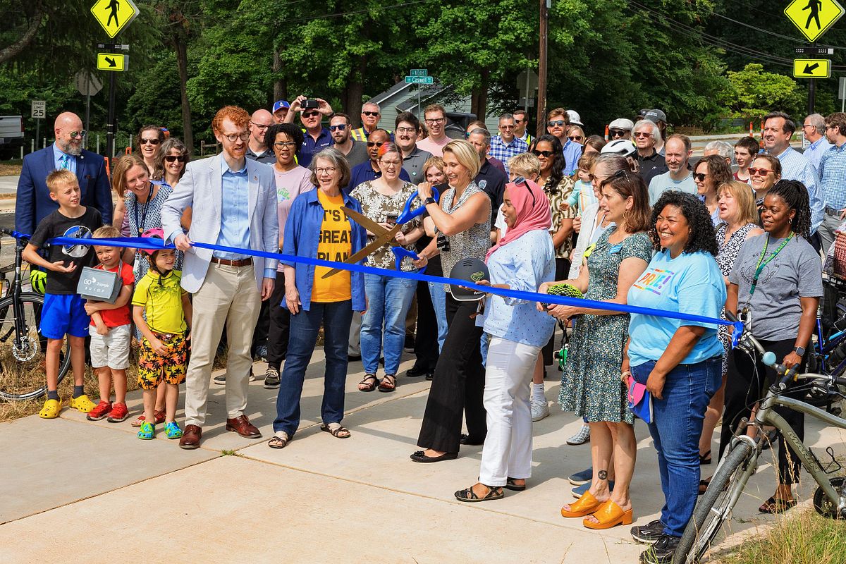 A ribbon cutting with member's of Chapel Hill's Town Council