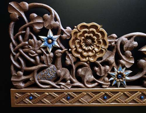 wood carving of a stylized turtle dove, flowers, and vines for the tabernacle at St. Bernadette Catholic Church