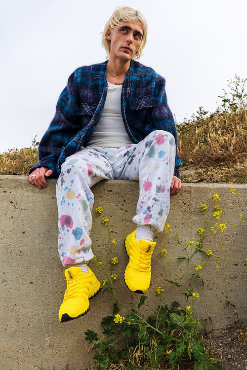 Model wearing K-Swiss sneakers in Los Angeles street setting — photographed by David Andrade
