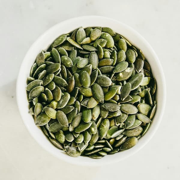 bowl of salted pepitas or pumpkin seeds