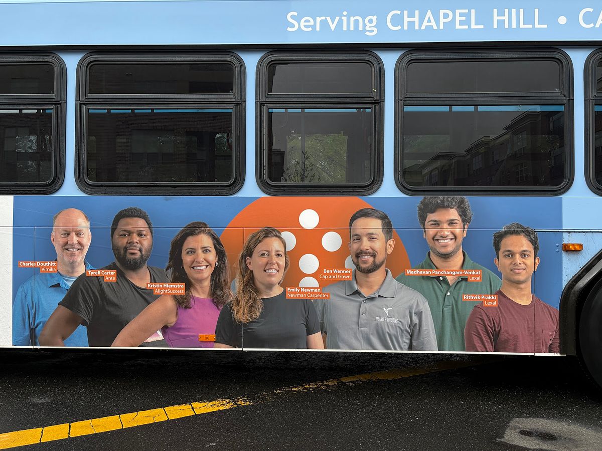 A Chapel Hill Transit bus ad featuring a composite photo of entrepreneur's from Innovate Carolina