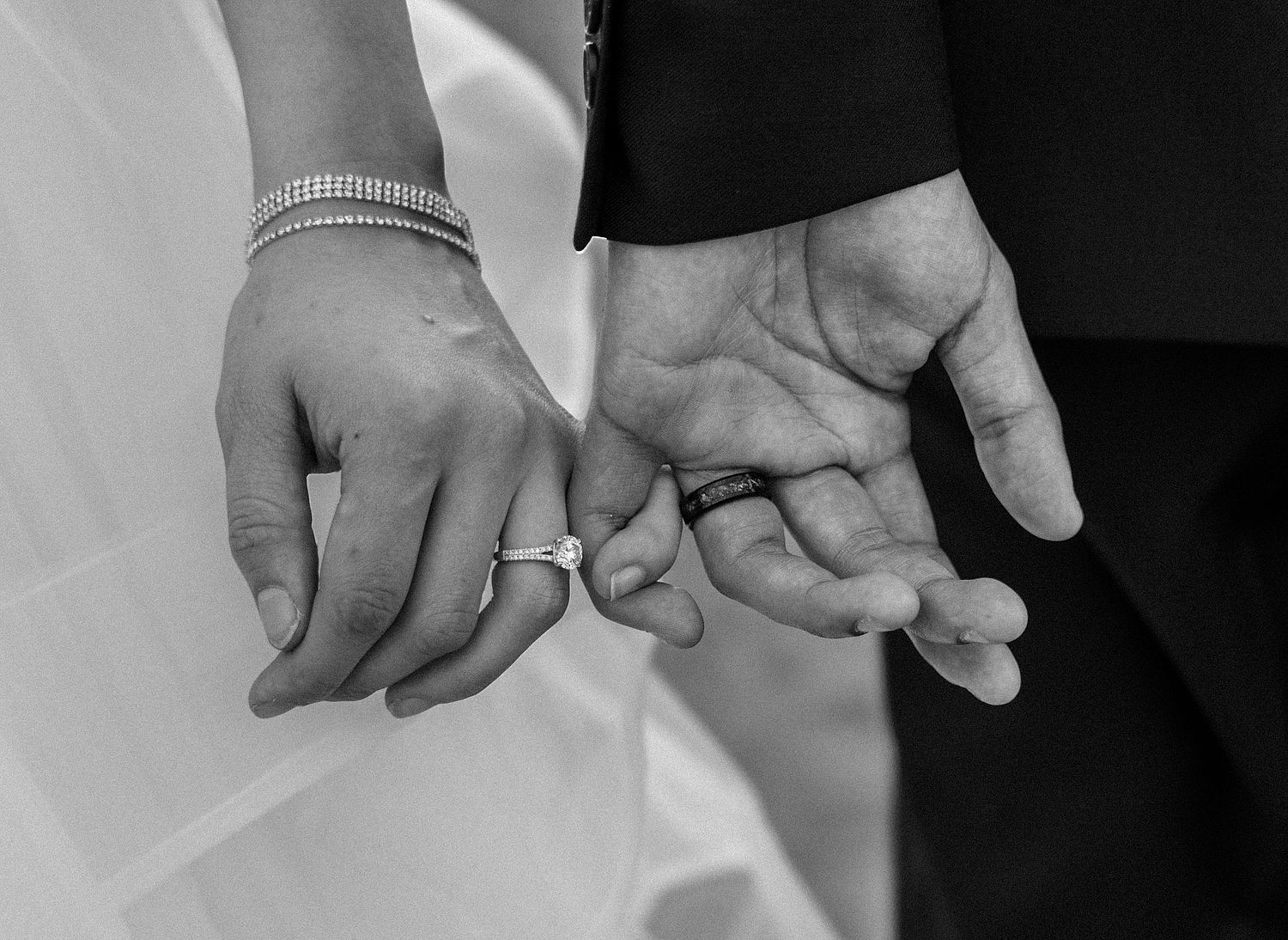 Bride and groom holding hands during wedding ceremony in Garretson, SD