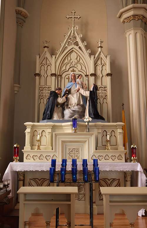 Side Altar of Our Lady of the Rosary with statues of Saint Dominic and Saint Catherine at Holy Trinity Catholic Church in Somerset, Ohio.