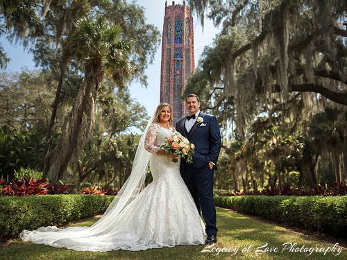 A happy mature bride and groom laughing at Bok Tower Gardens during their second marriage portrait session.