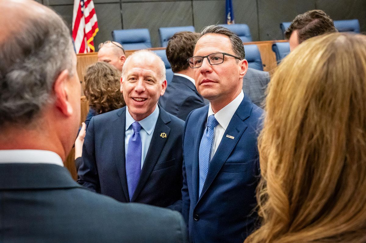 Corporate event photography capturing a state leader engaging in conversation with attendees during a judicial investiture ceremony in Philadelphia, emphasizing leadership presence, authentic connection, and the relational dynamics of civic spaces.