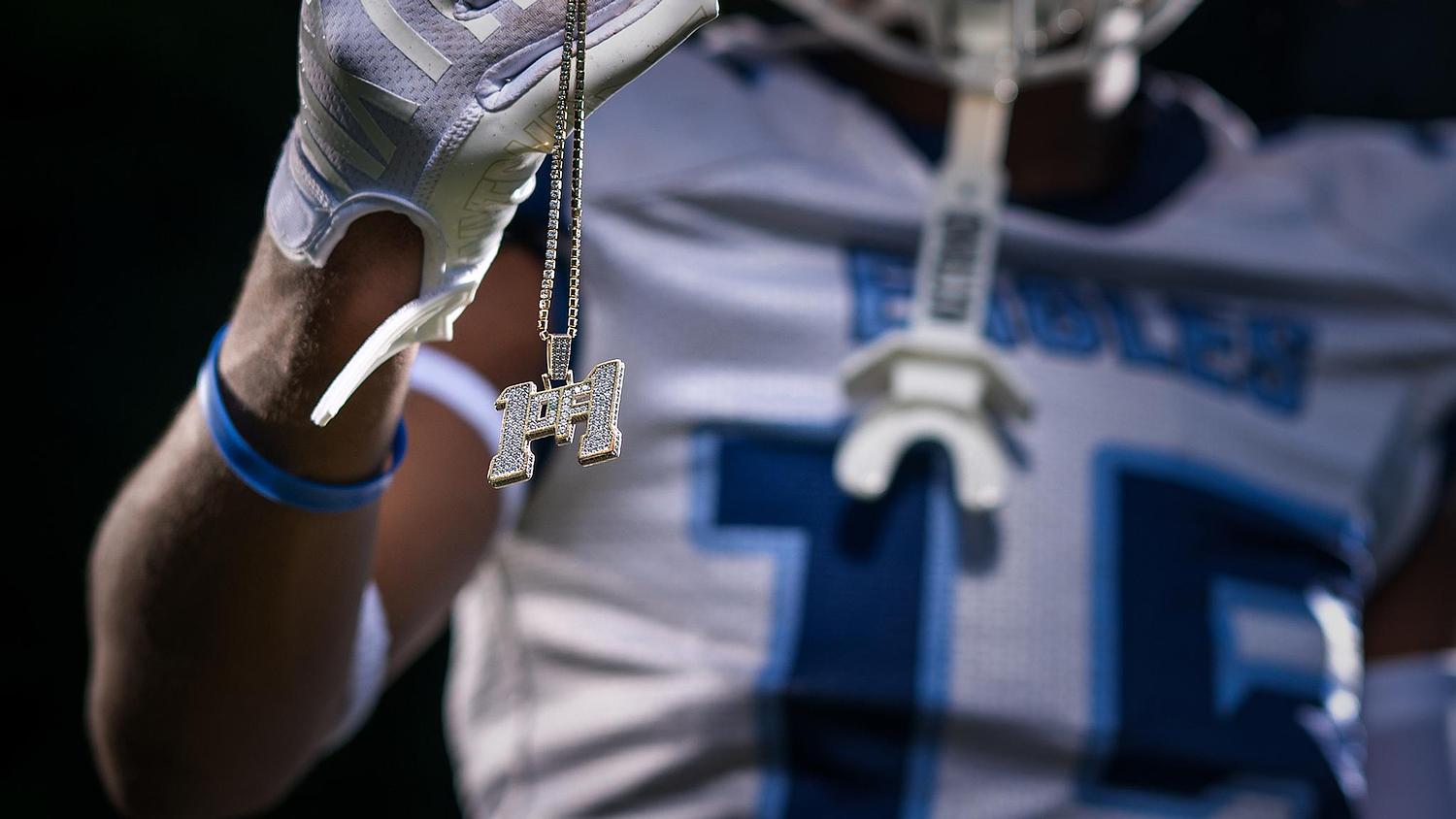 Beaufort Academy football player in action during a game, captured in a professional sports photography session showcasing skill and athleticism