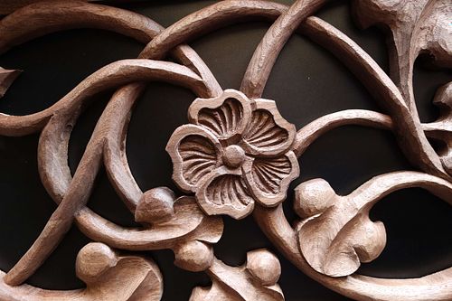 Hollyhock flower carved by hand in walnut for St. Joseph Shrine in St Bernadette Catholic Church in Lancaster, Ohio