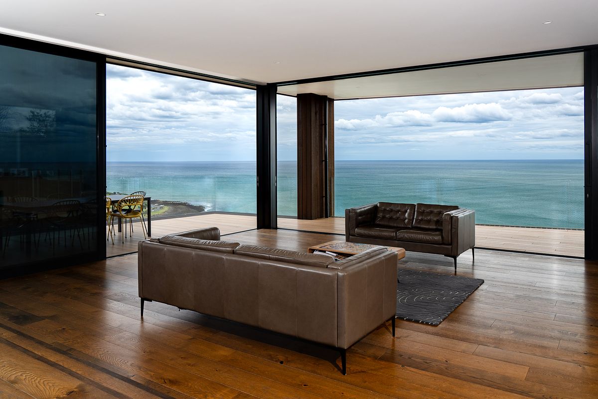 Luxury interior design photography of a modern home overlooking Manu Bay in Raglan by Flax Cove Studio