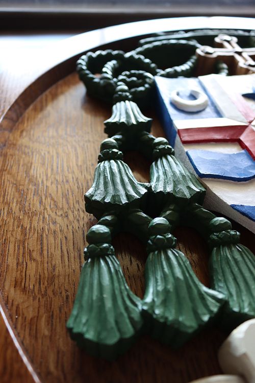 detail of fiocchi tassles on coat of arms