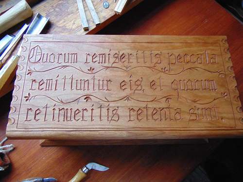 letter carving on the lid of another one of the carved cherry boxes