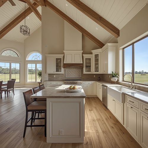 Interior real estate photography of a modern kitchen with vaulted wood-beam ceilings and a large island in Gainesville, FL, by PrimePropertyPhoto.