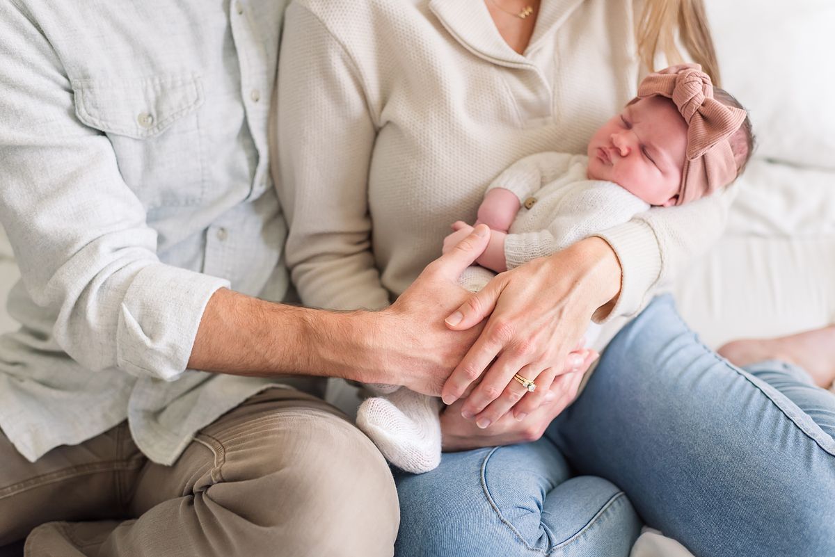 husband hugging wife and newborn baby girl with cranberry township, pa newborn photographer