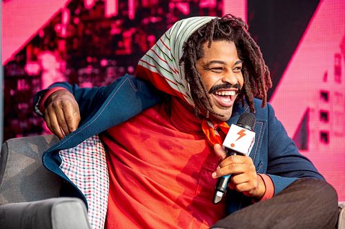 Charismatic speaker presenting at B.PHL Fest 2023 in Philadelphia, innovation and entrepreneurship festival, captured by professional event photographer during creative panel discussion.
