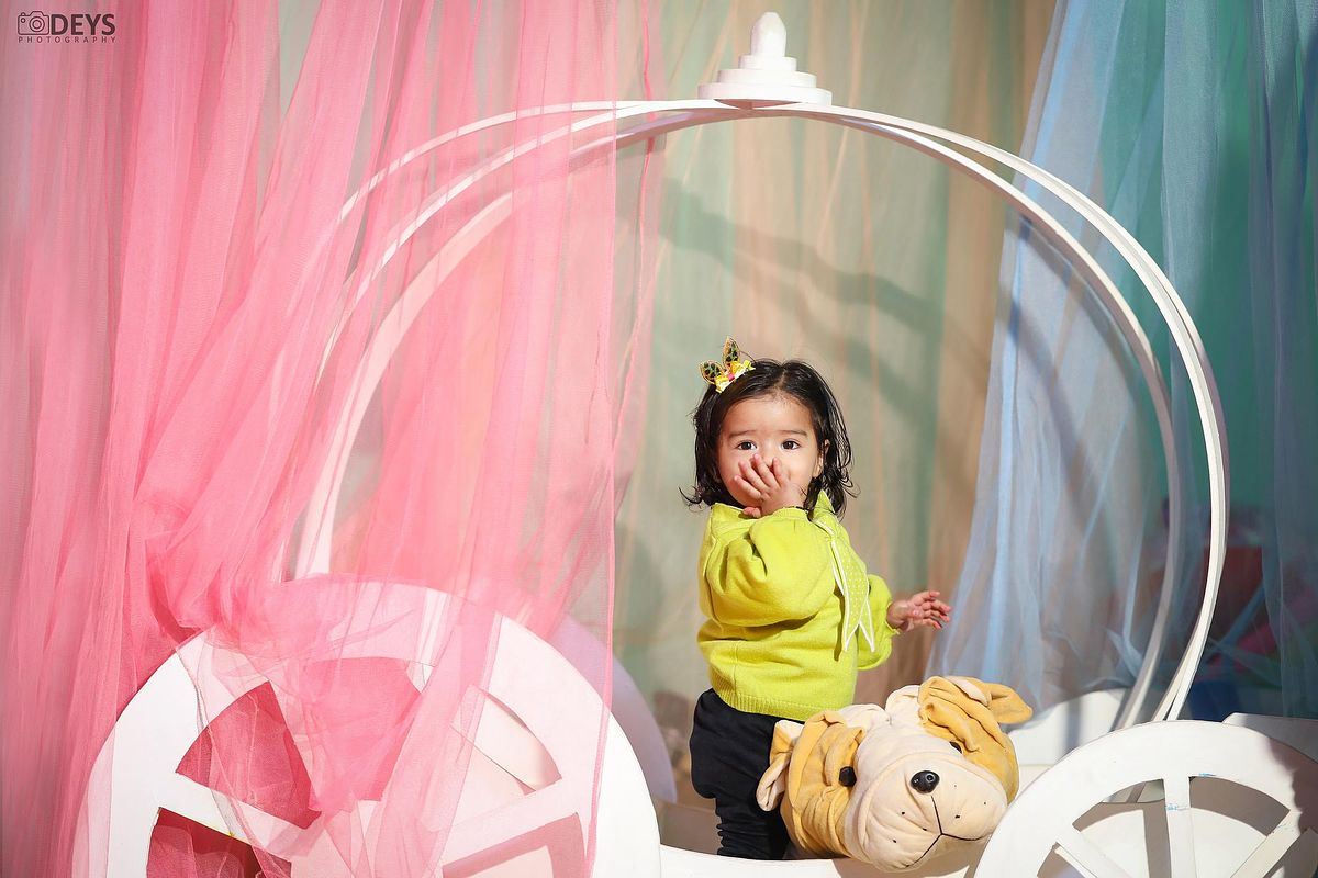 Baby girl in carriage shoot in Delhi at theme studio